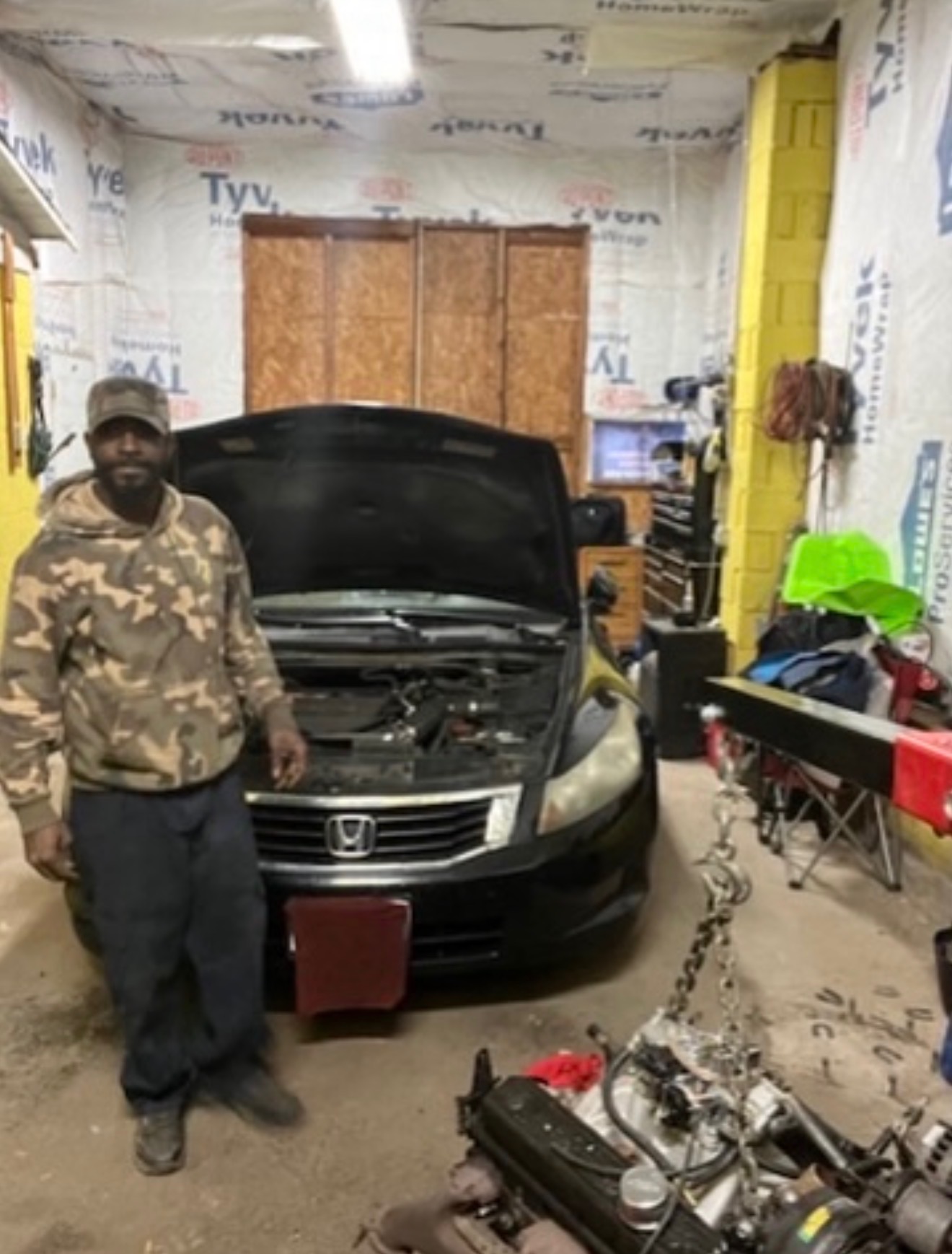 Rell at the shop with a Honda Accord ready for service
